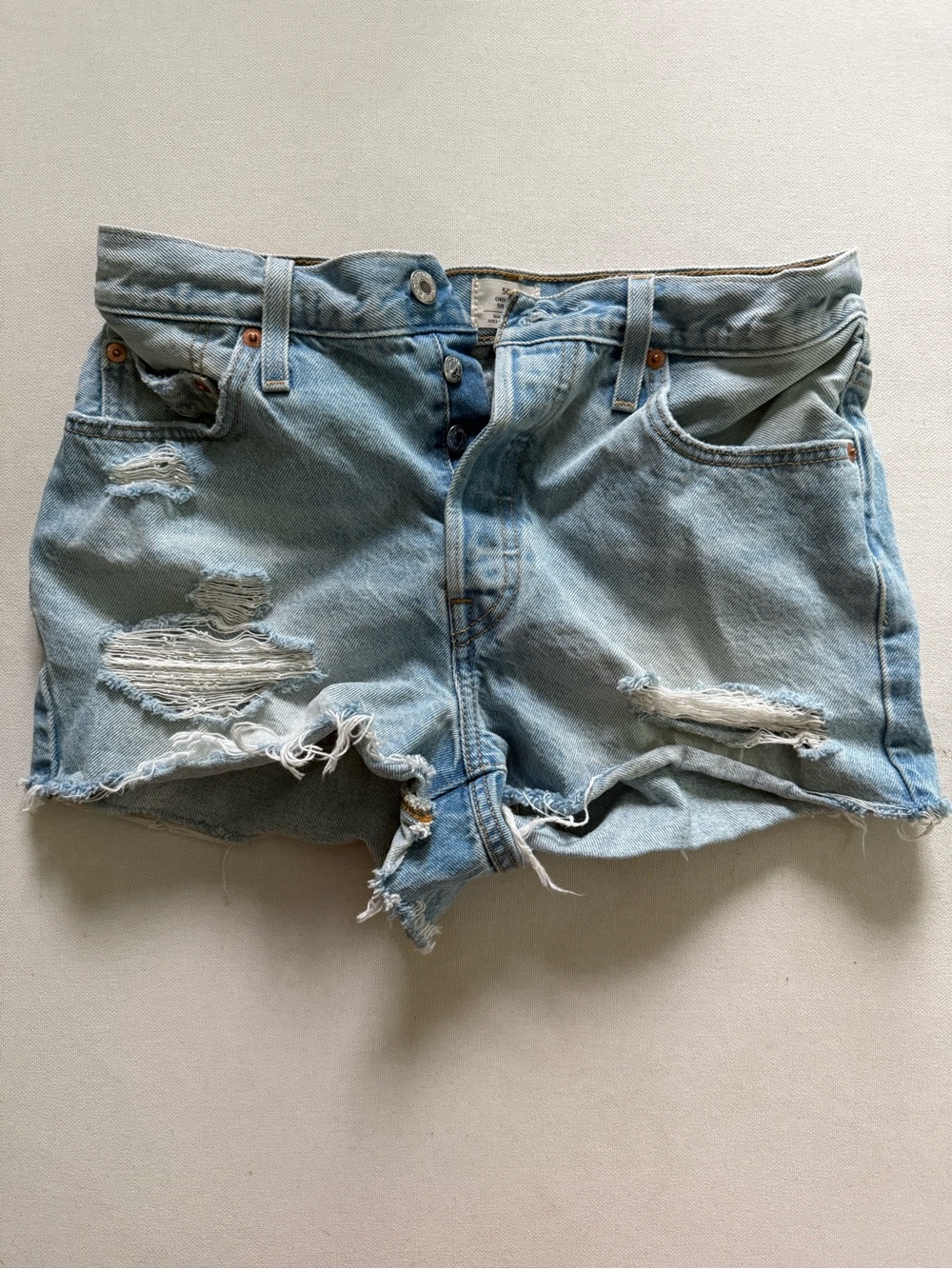 Levi’s 501 Light Blue Distressed Denim Shorts